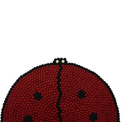 Tappeto rotondo in lana con motivo coccinella, fatto a mano.