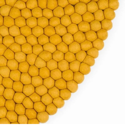 Tapis rond en laine jaune fait main