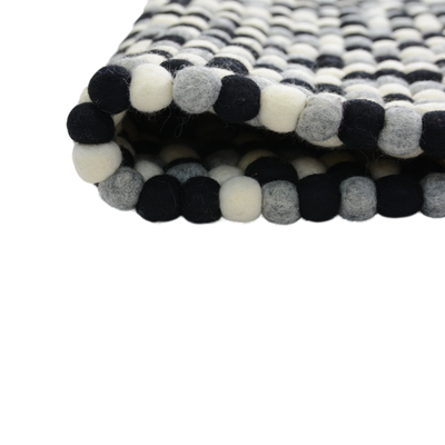 Handgeknüpfter Wollteppich in Schwarz und Weiß
