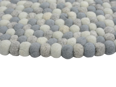 Tappeto rotondo fatto a mano in feltro misto grigio e lana.